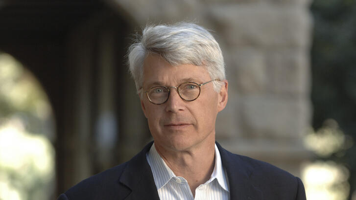 Man with glasses and gray hair