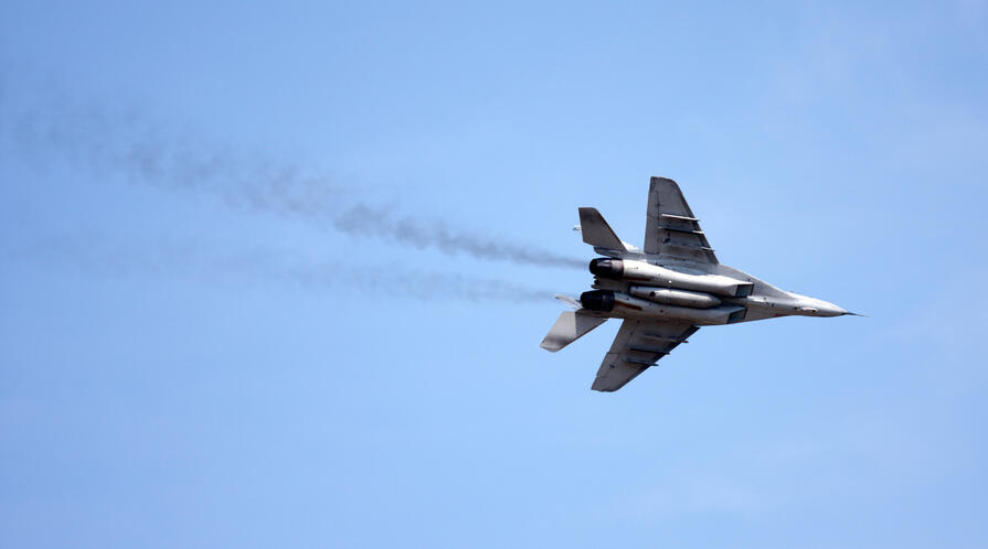 A Mig-29 'Fulcrum' executing a high banking Port turn at the Karup airshow.